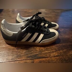 Adidas Black and White Athletic Shoes with Iconic Stripes